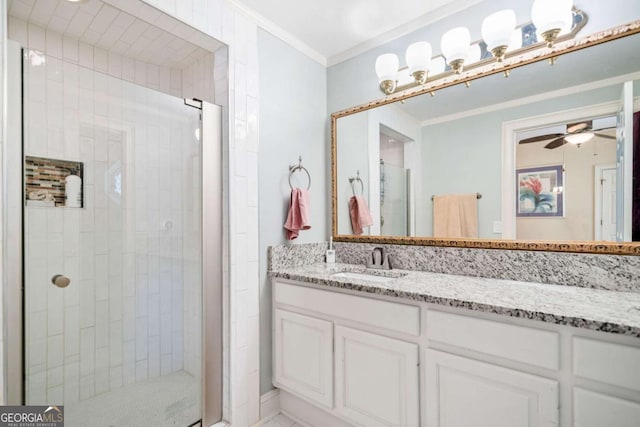 full bath featuring ornamental molding, a shower stall, vanity, and a ceiling fan