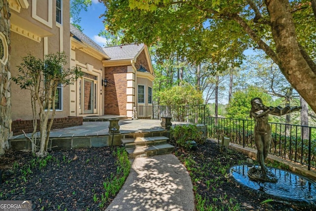 view of yard featuring a patio and fence