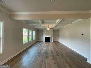 unfurnished living room with a fireplace, dark wood-style flooring, baseboards, and coffered ceiling