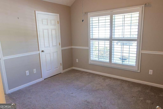 1910 Charleston Oak Cir, Lawrenceville, GA 30043 - empty room with plenty of natural light, baseboards, and carpet floors