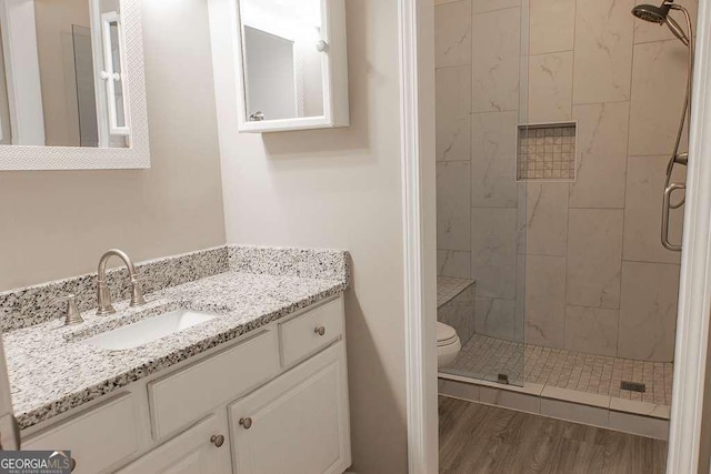 1910 Charleston Oak Cir, Lawrenceville, GA 30043 - full bath with toilet, vanity, a stall shower, and wood finished floors