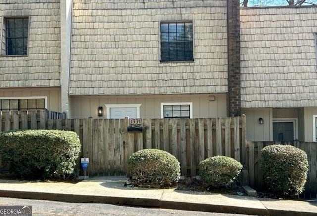 1331 Woodstone Trce, Morrow, GA 30260 - view of side of property with fence and mansard roof