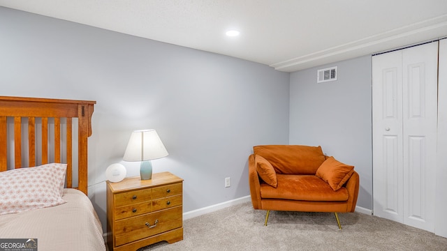 carpeted bedroom featuring a closet, recessed lighting, visible vents, and baseboards