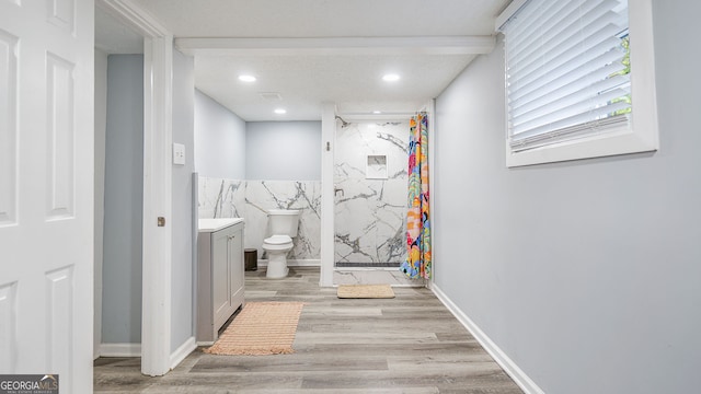 full bath with vanity, recessed lighting, toilet, a marble finish shower, and wood finished floors