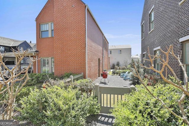 view of property exterior with brick siding