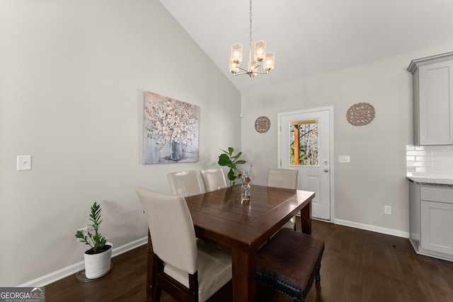dining space with a chandelier, high vaulted ceiling, baseboards, and dark wood finished floors