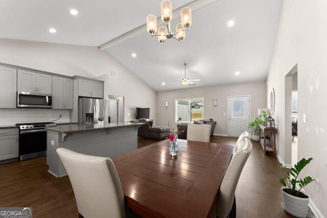 dining room featuring visible vents, dark wood-style floors, beamed ceiling, ceiling fan with notable chandelier, and high vaulted ceiling
