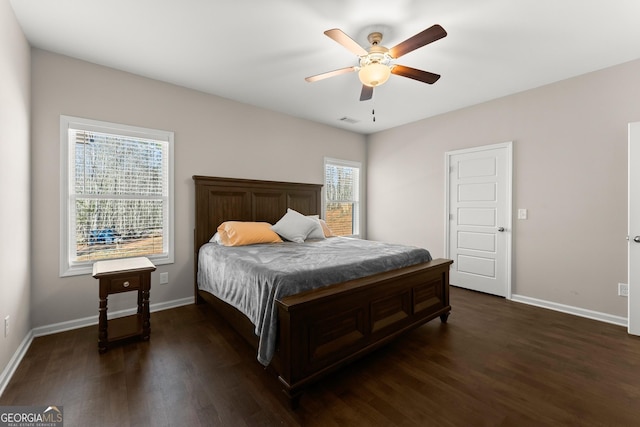 bedroom featuring dark wood-style flooring and baseboards
