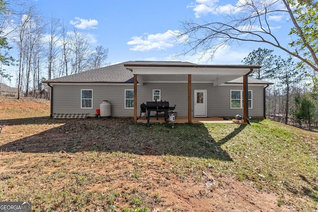 rear view of property featuring a patio