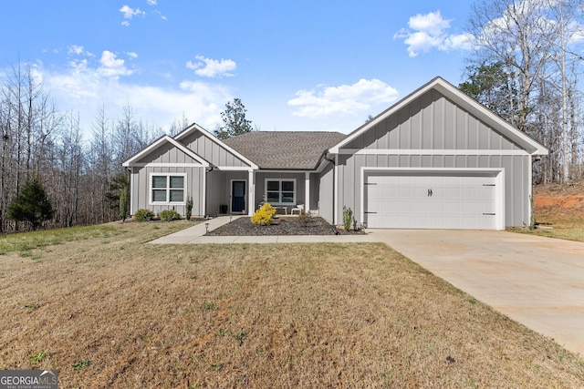 view of front of house featuring roof with shingles, driveway, board and batten siding, a front yard, and a garage