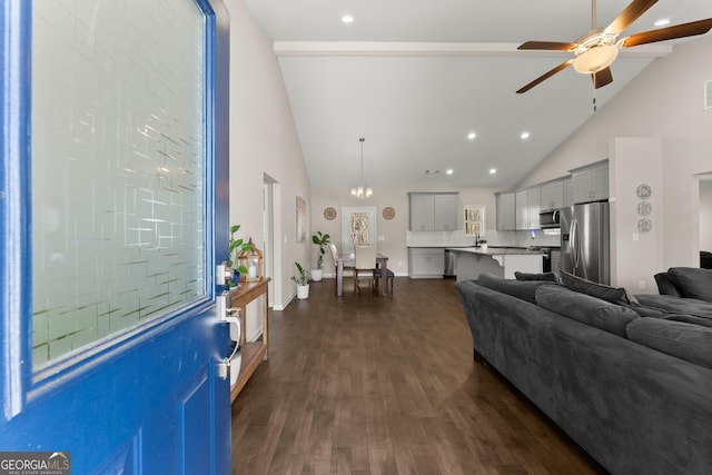 living area featuring dark wood-type flooring, high vaulted ceiling, a ceiling fan, and recessed lighting