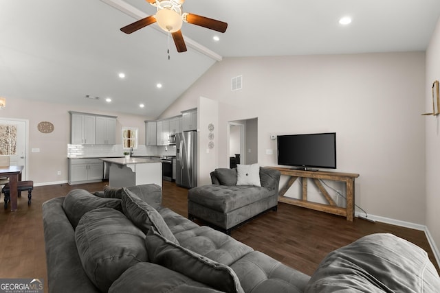 living room featuring visible vents, baseboards, a ceiling fan, dark wood-style floors, and beam ceiling