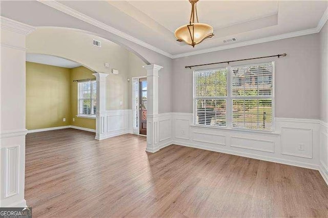 6655 Grove Meadows Ln, Cumming, GA 30028 - unfurnished room with arched walkways, a healthy amount of sunlight, decorative columns, and visible vents