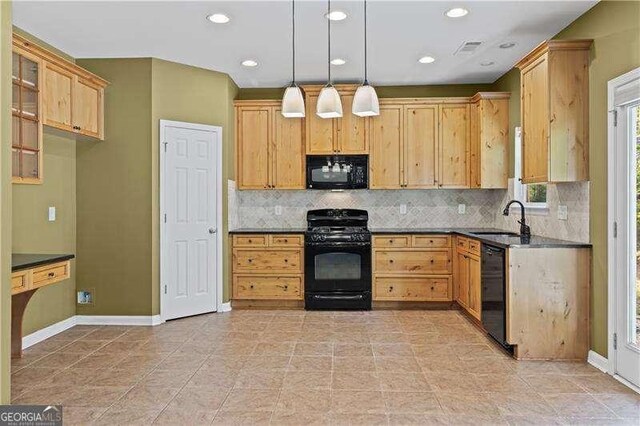6655 Grove Meadows Ln, Cumming, GA 30028 - kitchen featuring dark countertops, black appliances, visible vents, decorative backsplash, and a sink