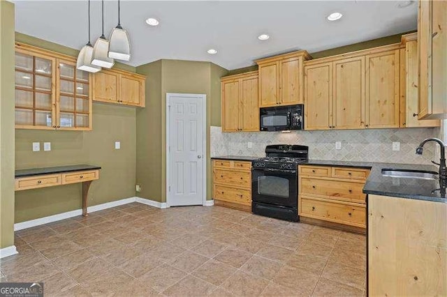 6655 Grove Meadows Ln, Cumming, GA 30028 - kitchen with baseboards, a sink, black appliances, pendant lighting, and decorative backsplash
