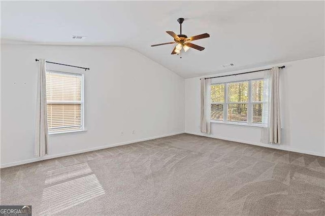 6655 Grove Meadows Ln, Cumming, GA 30028 - carpeted empty room featuring visible vents, ceiling fan, plenty of natural light, and vaulted ceiling