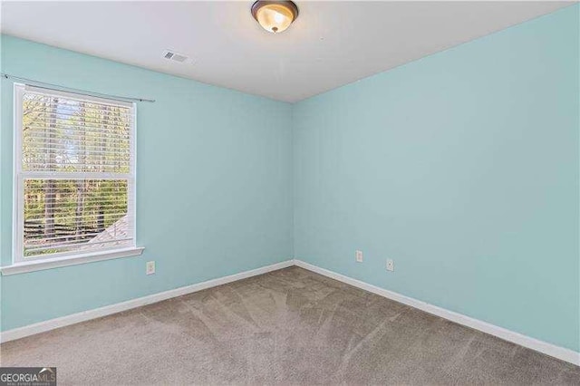 6655 Grove Meadows Ln, Cumming, GA 30028 - unfurnished room with visible vents, baseboards, plenty of natural light, and carpet floors