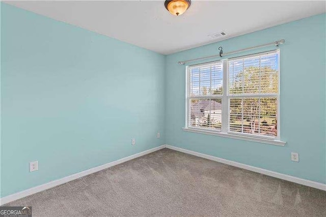 6655 Grove Meadows Ln, Cumming, GA 30028 - empty room with visible vents, baseboards, and carpet floors
