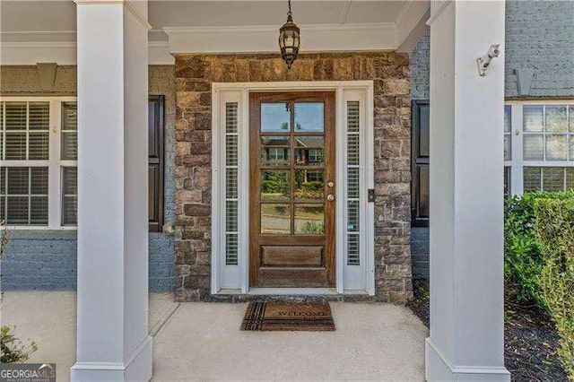 6655 Grove Meadows Ln, Cumming, GA 30028 - view of exterior entry featuring a porch and stone siding