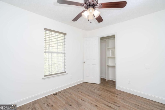 166 Rustin Dr, Dallas, GA 30157 - unfurnished bedroom featuring wood finished floors and ceiling fan