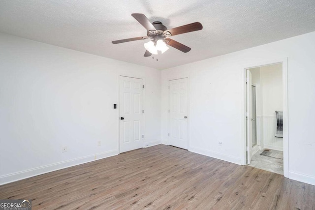 166 Rustin Dr, Dallas, GA 30157 - empty room featuring wood finished floors, ceiling fan, and a textured ceiling