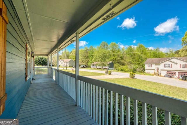 166 Rustin Dr, Dallas, GA 30157 - wooden porch with a residential view and a lawn