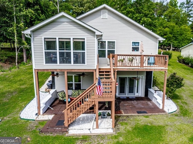 rear view of house with a patio, stairway, a ceiling fan, a yard, and a deck