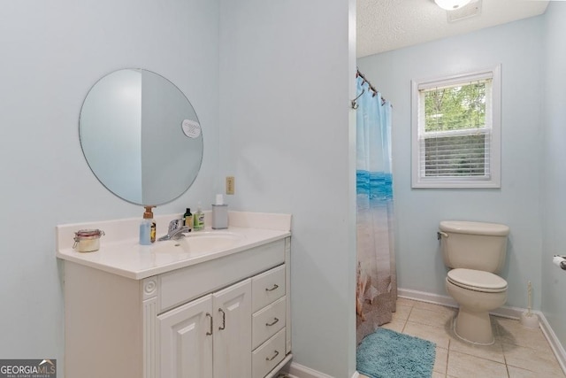 bathroom featuring vanity, baseboards, tile patterned flooring, toilet, and visible vents
