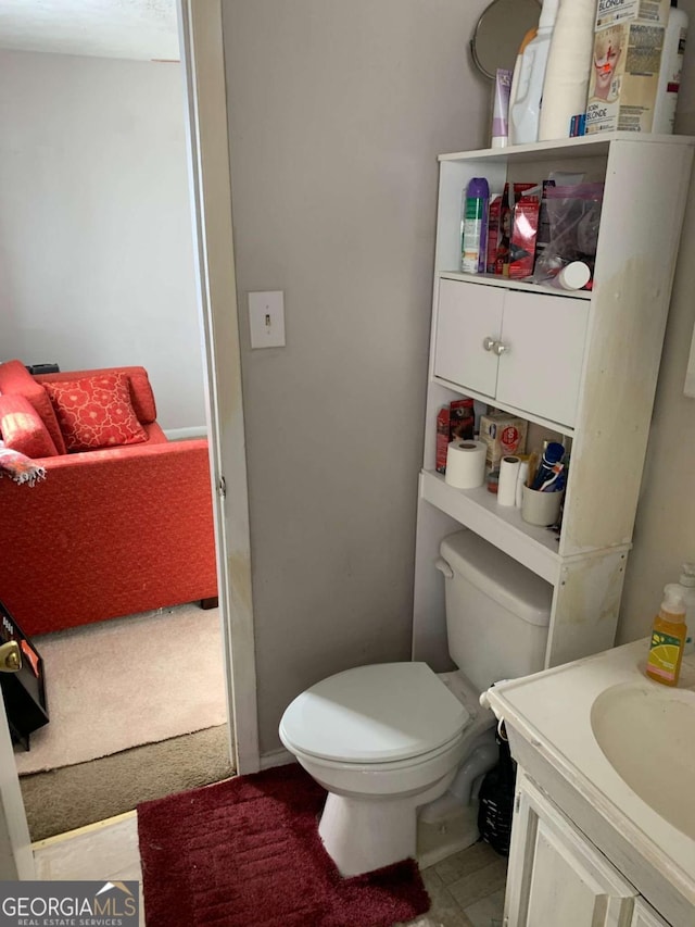 bathroom with toilet and vanity
