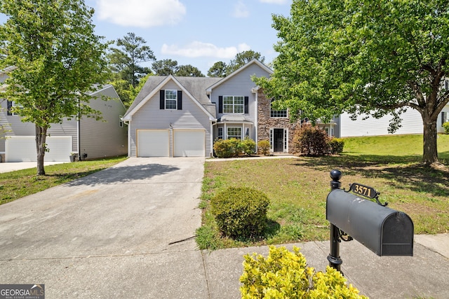 3571 Oakshire Way SE, Atlanta, GA 30354 - view of front of house with concrete driveway, stone siding, and a front lawn