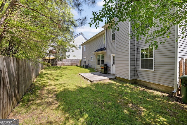 3571 Oakshire Way SE, Atlanta, GA 30354 - back of property with a patio area, a fenced backyard, and a lawn