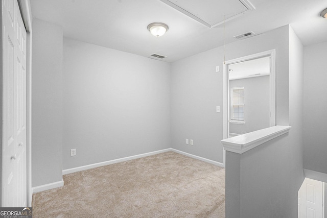 1728 Devon Dr SW, Atlanta, GA 30311 - carpeted empty room with attic access, visible vents, and baseboards