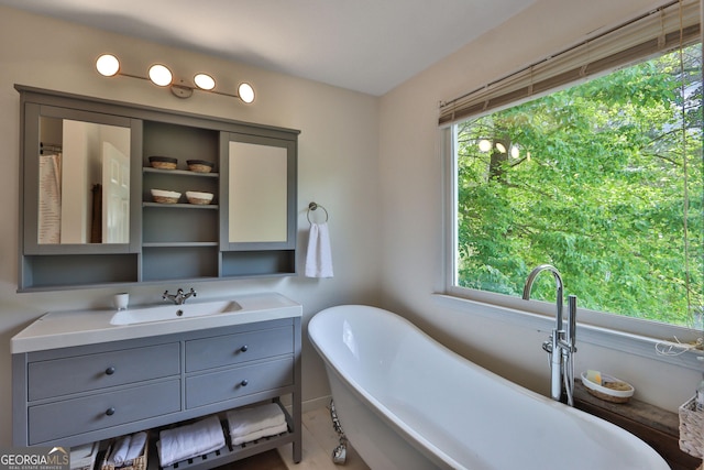 2675 Dacula Ridge Dr, Dacula, GA 30019 - full bath with plenty of natural light, vanity, and a freestanding tub
