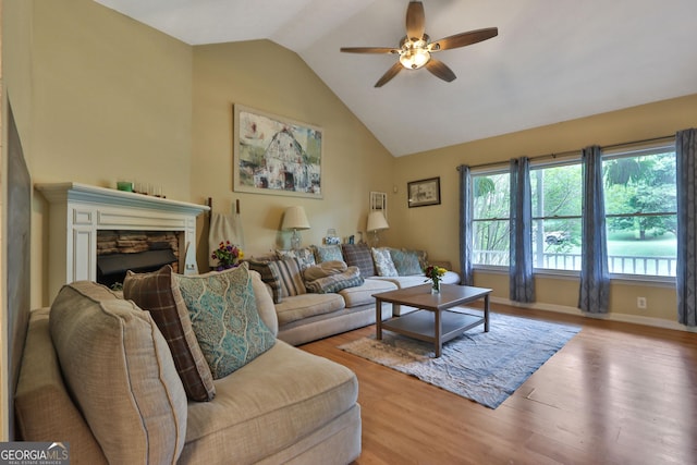 2675 Dacula Ridge Dr, Dacula, GA 30019 - living room featuring lofted ceiling, ceiling fan, and wood finished floors