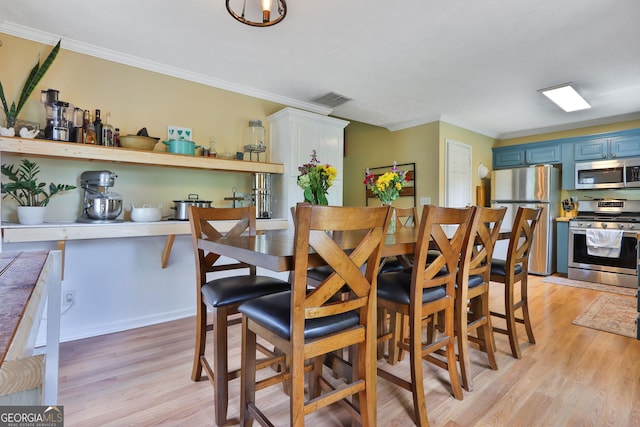 2675 Dacula Ridge Dr, Dacula, GA 30019 - dining space featuring light wood-style floors and ornamental molding