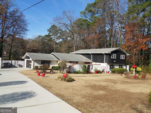 4213 Janice Dr, Atlanta, GA 30337 - view of front facade featuring concrete driveway and a front lawn