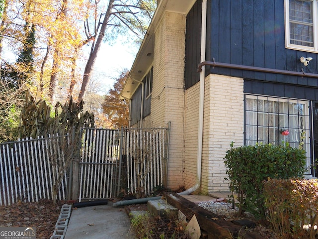 4213 Janice Dr, Atlanta, GA 30337 - view of property exterior featuring brick siding and fence