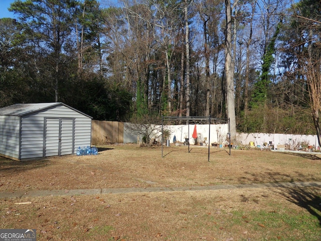 4213 Janice Dr, Atlanta, GA 30337 - view of yard with fence private yard, an outbuilding, and a storage unit
