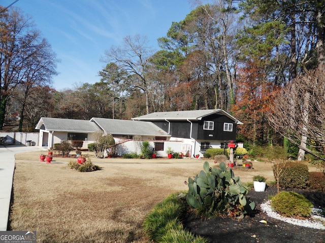 4213 Janice Dr, Atlanta, GA 30337 - view of front of house with a front yard, an attached garage, and driveway