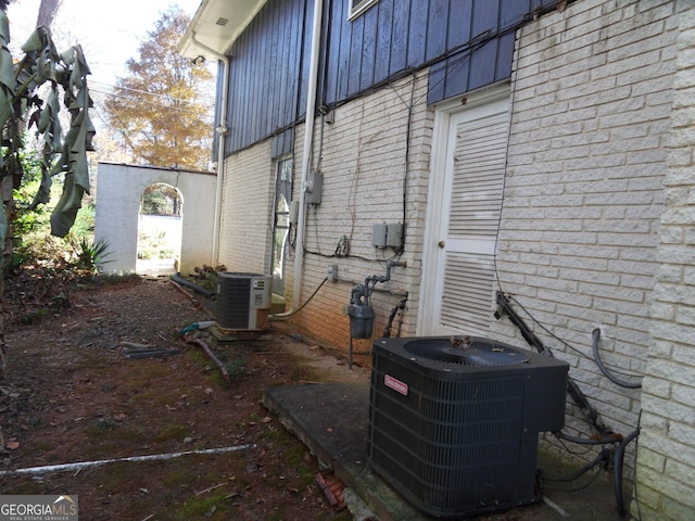 4213 Janice Dr, Atlanta, GA 30337 - view of side of property with central air condition unit and brick siding