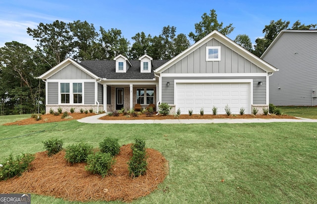 craftsman inspired home with an attached garage, board and batten siding, and a front yard