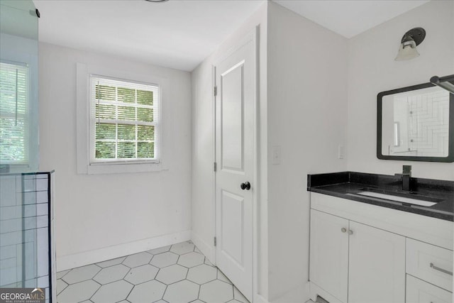 bathroom with vanity and baseboards