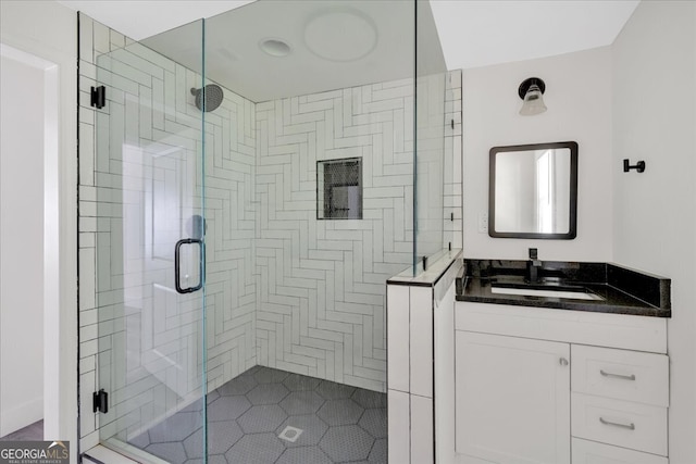 bathroom with vanity and a shower stall