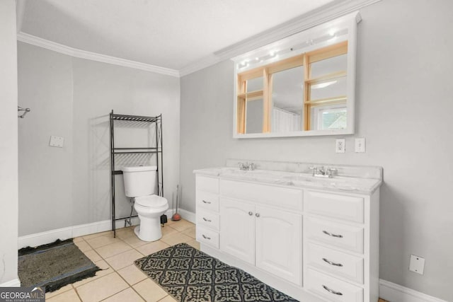 bathroom with ornamental molding, tile patterned flooring, toilet, double vanity, and baseboards