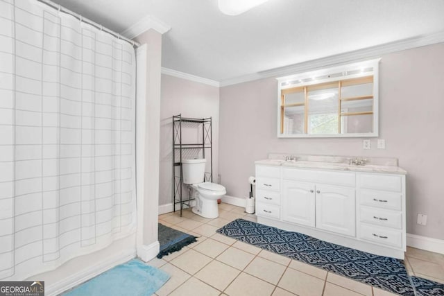 full bath with baseboards, double vanity, tile patterned flooring, crown molding, and toilet