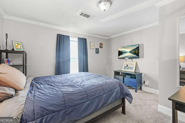 carpeted bedroom featuring visible vents, baseboards, and crown molding