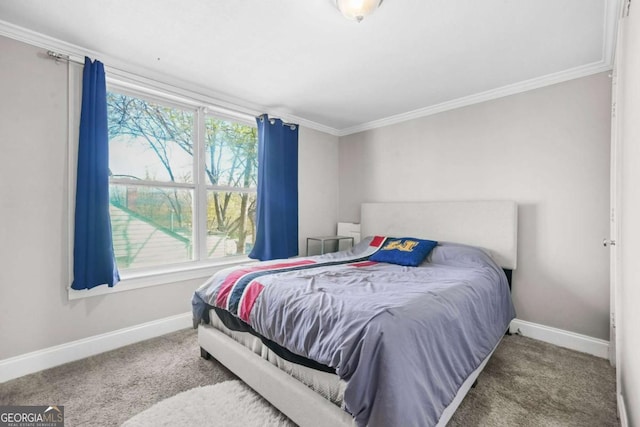 carpeted bedroom with crown molding and baseboards