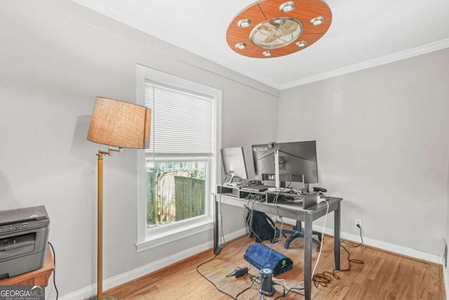 home office featuring ornamental molding, baseboards, and wood finished floors