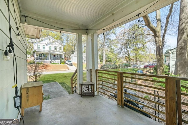 view of patio / terrace with a porch and a residential view