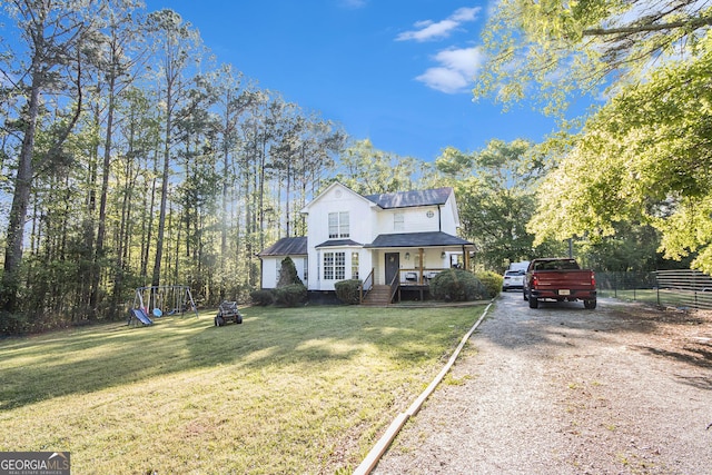 286 Opal St, Luthersville, GA 30251 - traditional-style house featuring a playground, fence, driveway, and a front yard